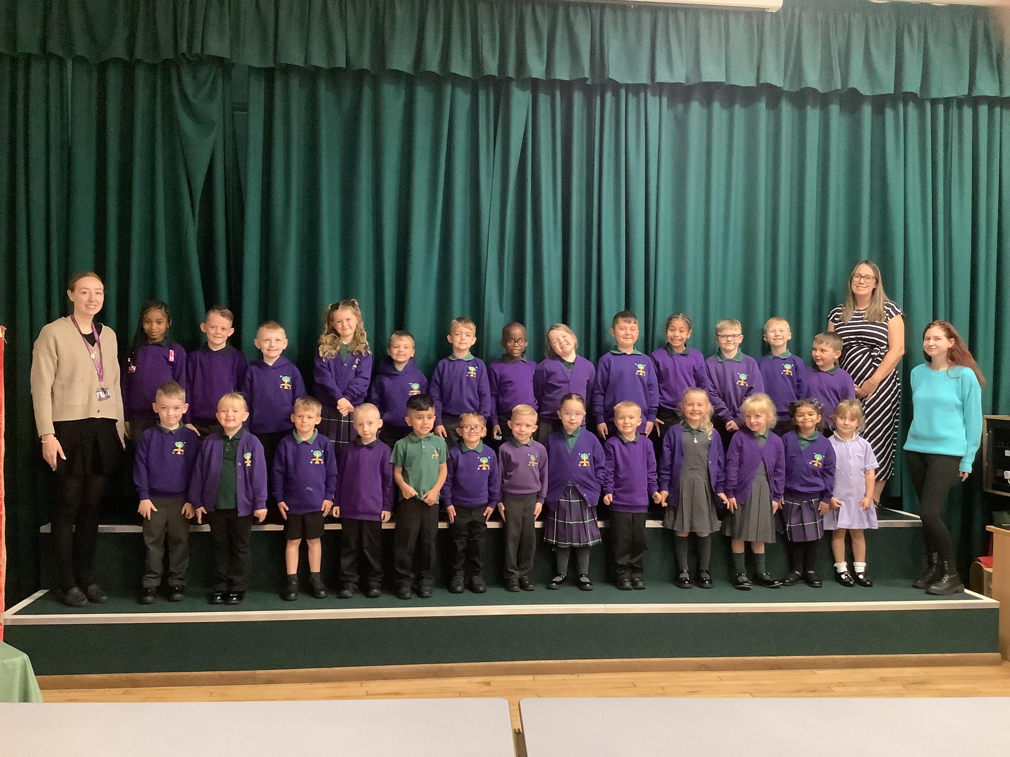 Picture of children and staff in Flamingoes Class